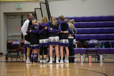 Pictured above the girls basketball team huddles up before their game on March 3rd.