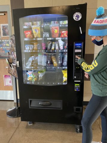 SHS student uses the vending machine.