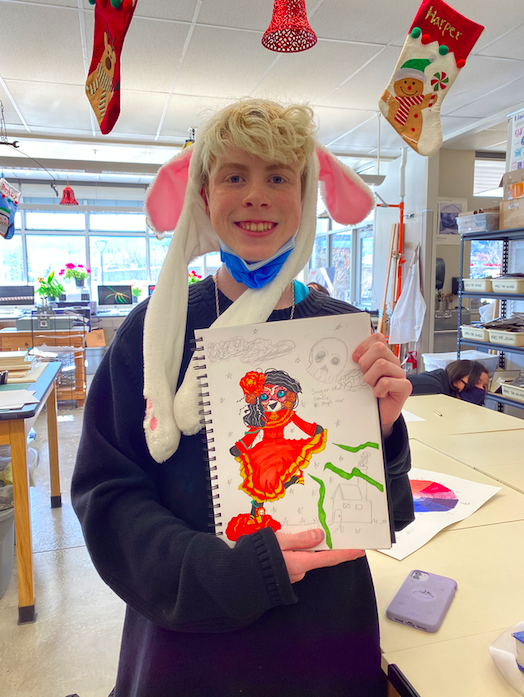 Tristan+Borders%2C+Freshman%2C+poses+with+his+bullet+journal+during+Janine+Frazee%E2%80%99s+Bullet+Journaling+Club.