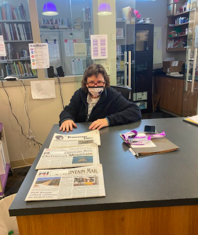 Former middle school teacher Leslie Garrity subs for Kate Clark in the library. Present and past teachers have been willing to step up to fill each others positions when substitutes are difficult to come by.